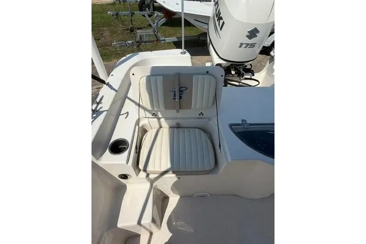 Slide: The Image of 2017 Carolina Skiff 238 DLV boat seat with Suzuki 175 engine in background. - 18