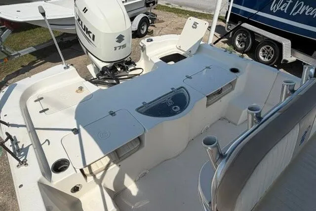 Slide: The Image of 2017 Carolina Skiff 238 DLV boat with Suzuki 175 engine, featuring spacious deck layout. - 17