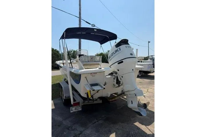 Slide: The Image of 2017 Carolina Skiff 238 DLV boat with Suzuki outboard motor on trailer. - 3