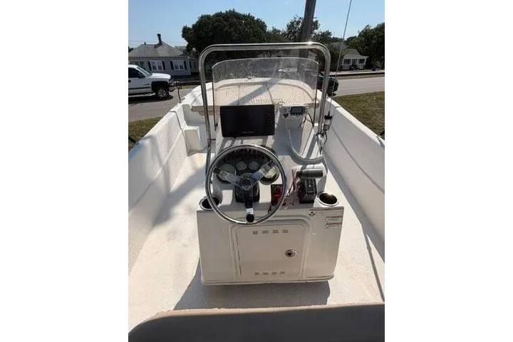Slide: The Image of 2017 Carolina Skiff 238 DLV boat console with steering wheel and controls. - 23