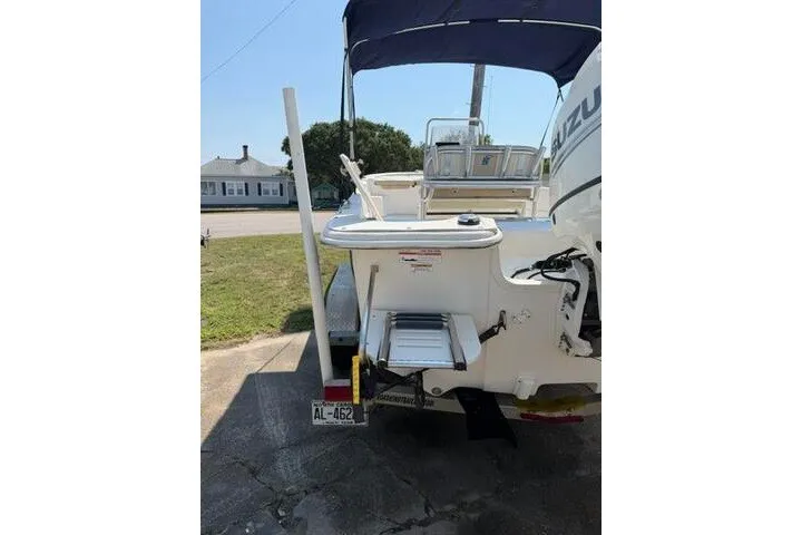 Slide: The Image of 2017 Carolina Skiff 238 DLV boat with outboard motor and swim platform. - 4