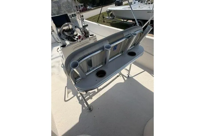 Slide: The Image of 2017 Carolina Skiff 238 DLV boat interior with rod holders and steering console. - 22