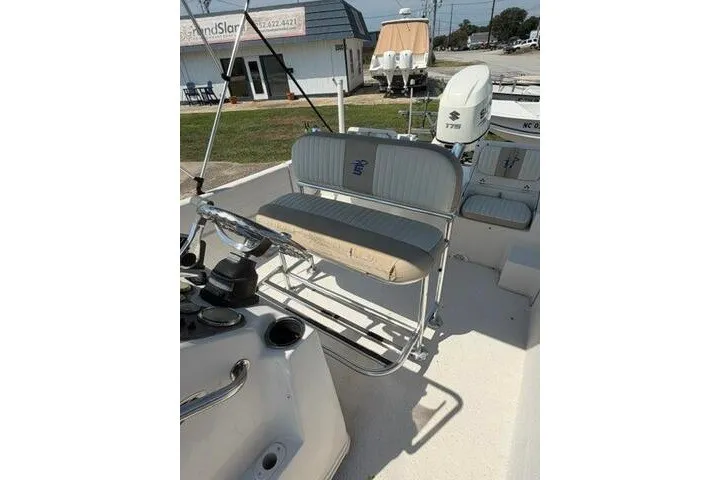 Slide: The Image of 2017 Carolina Skiff 238 DLV boat interior with seating and controls. - 26
