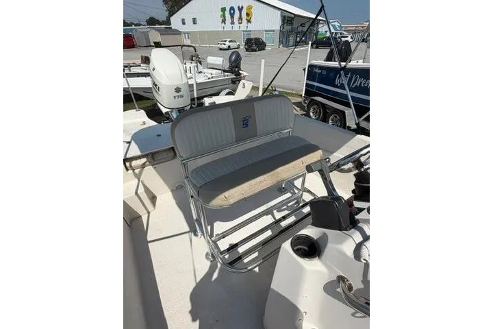 Slide: The Image of 2017 Carolina Skiff 238 DLV boat interior with seating and control panel. - 16