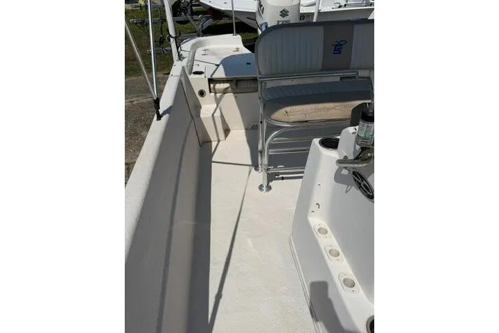 Slide: The Image of 2017 Carolina Skiff 238 DLV boat interior with seating and deck view. - 15