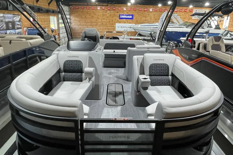 Slide: The Image of 2027 Harris Solstice 230 SL pontoon boat interior with luxurious seating and modern design. - 13