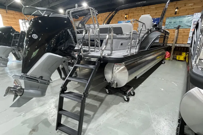 Slide: The Image of 2027 Harris Solstice 230 SL pontoon boat with Mercury outboard engine in showroom. - 20