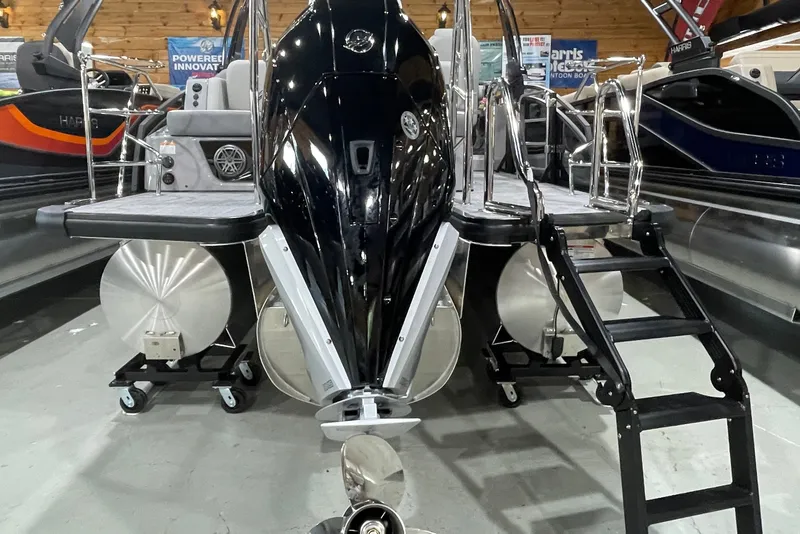Slide: The Image of 2027 Harris Solstice 230 SL pontoon boat displayed indoors with sleek design and modern features. - 16