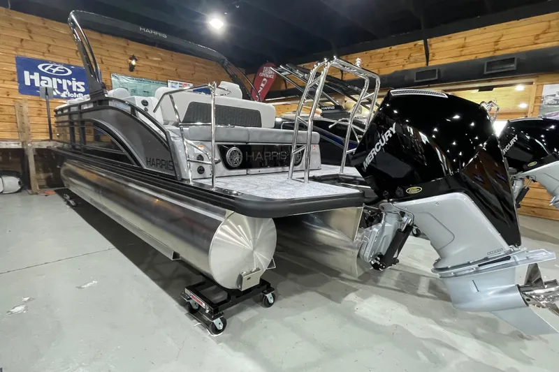 Slide: The Image of 2027 Harris Solstice 230 SL pontoon boat with Mercury outboard motor in showroom. - 22