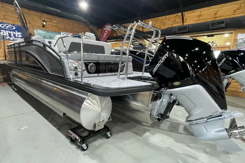 Slide: The Image of 2027 Harris Solstice 230 SL pontoon boat with Mercury outboard engine in showroom. - 17