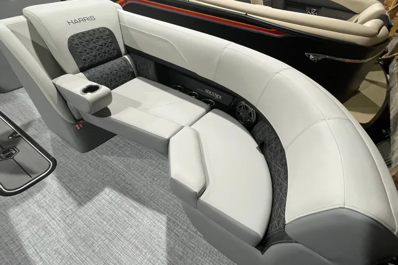 Slide: The Image of Luxurious seating on 2027 Harris Solstice 230 SL boat, featuring elegant upholstery and cup holder. - 24