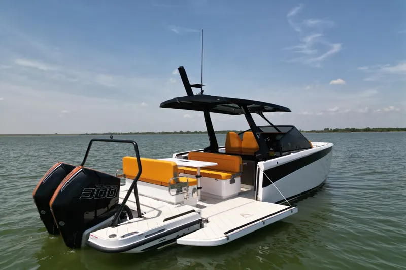 Slide: The Image of Modern 2026 VIRTUE YACHTS V33 Top on water, featuring sleek design and vibrant seating. - 4