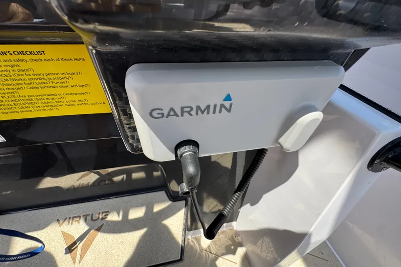 Slide: The Image of Garmin device on VIRTUE YACHTS V33 Top, 2026 model, with checklist in background. - 24
