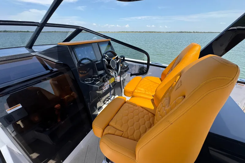 Slide: The Image of Luxurious 2026 VIRTUE YACHTS V33 Top cockpit with orange seats and modern controls. - 17