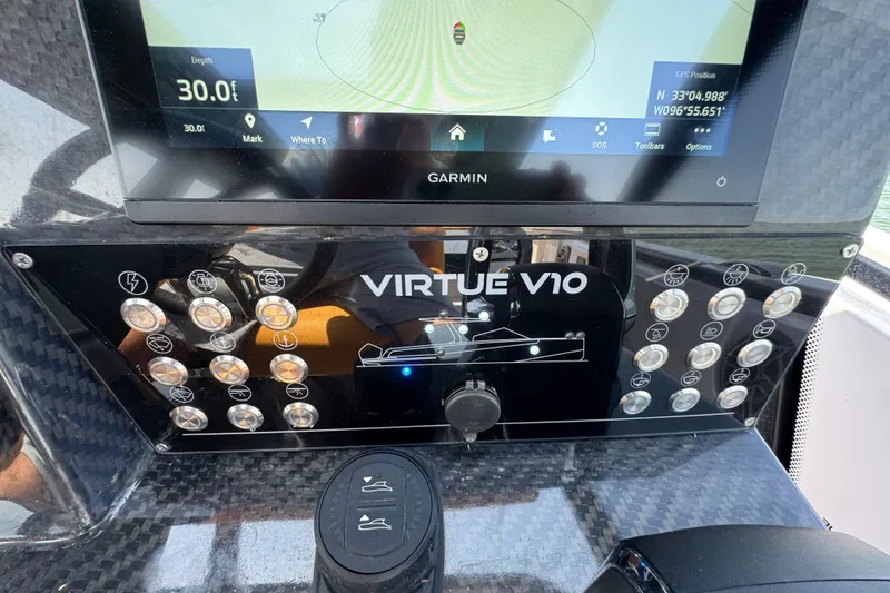 Slide: The Image of Control panel of 2026 VIRTUE YACHTS V33 Top with Garmin display and navigation controls. - 22