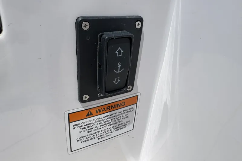 Slide: The Image of Control panel on 2026 VIRTUE YACHTS V33 Top with anchor warning label. - 14