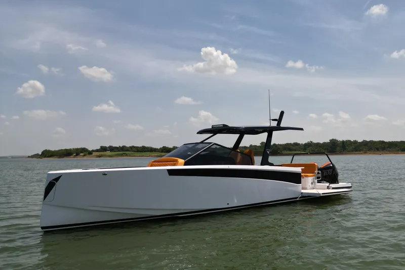 Slide: The Image of 2026 VIRTUE YACHTS V33 Top on serene water under blue sky. - 3