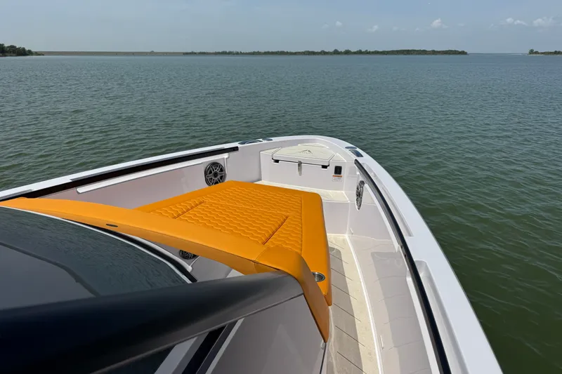 Slide: The Image of Luxury VIRTUE YACHTS V33 Top 2026 on serene water, featuring sleek design and vibrant seating. - 11