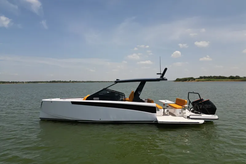 Slide: The Image of 2026 VIRTUE YACHTS V33 Top on calm water, sleek design, sunny day. - 1