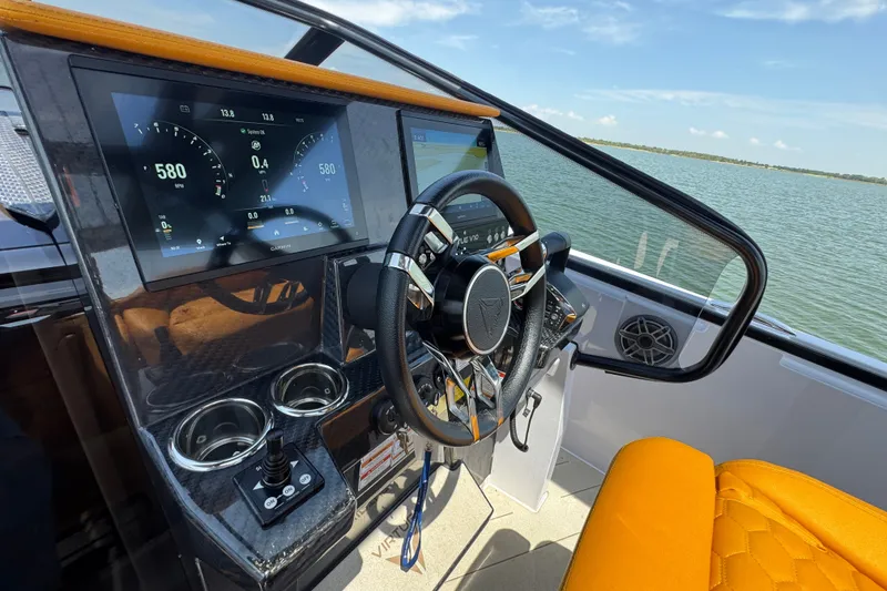 Slide: The Image of Cockpit of 2026 VIRTUE YACHTS V33 Top with modern controls and steering wheel. - 20