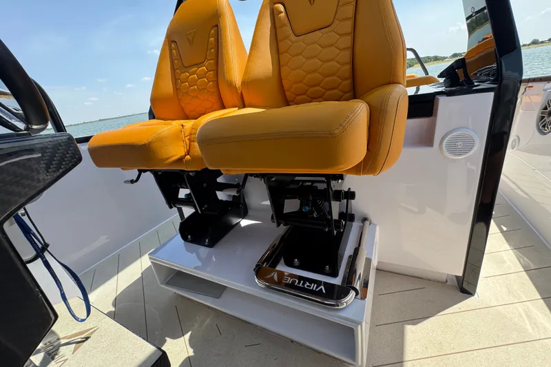 Slide: The Image of Luxury seating on 2026 VIRTUE YACHTS V33 Top, featuring stylish orange upholstery. - 18
