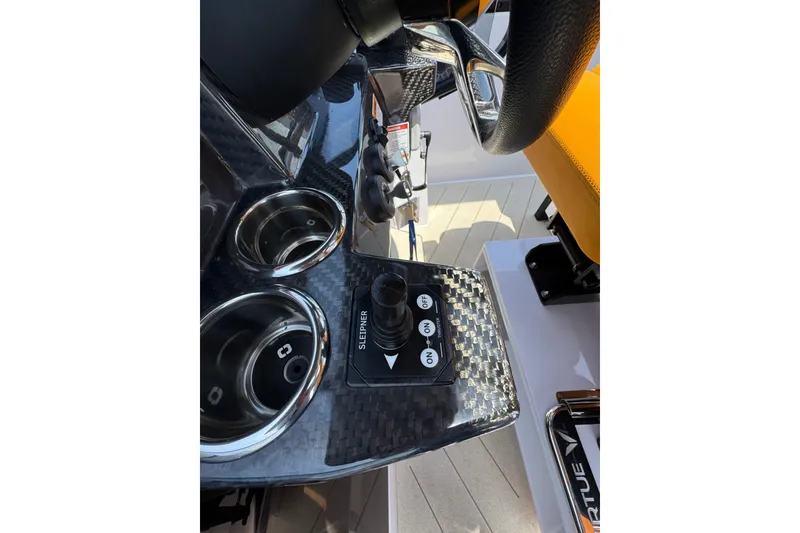 Slide: The Image of Control panel of 2026 VIRTUE YACHTS V33 Top with sleek carbon fiber finish. - 19