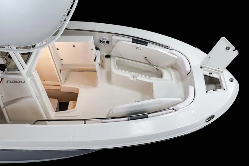 Slide: The Image of Manufacturer Provided Image: 2021 Robalo R200 Center Console boat interior, featuring spacious seating and storage compartments. - 15