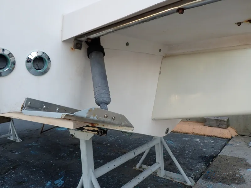 Slide: The Image of Close-up of the stern of a Grady-White Gulfstream 232S boat resting on stands. - 26