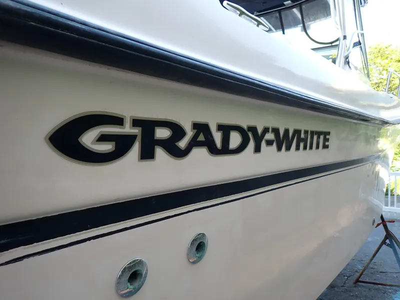 Slide: The Image of Close-up of Grady-White Gulfstream 232S boat hull with logo and hull details. - 29