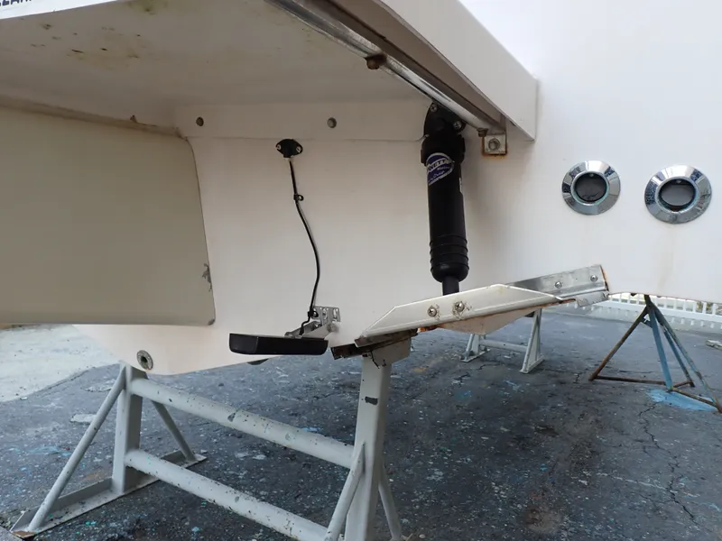 Slide: The Image of Close-up of the stern of a Grady-White Gulfstream 232S boat with trim tabs. - 27
