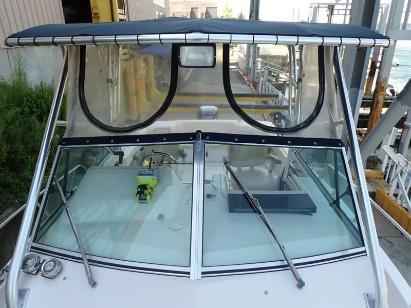 Slide: The Image of 2003 Grady-White Gulfstream 232S with spacious cockpit and sturdy hardtop. - 13