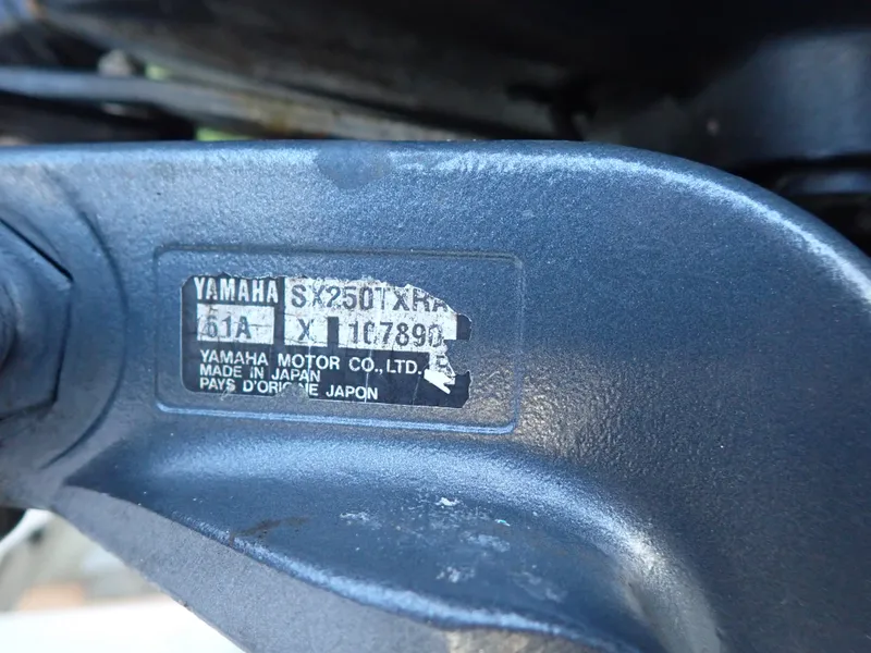 Slide: The Image of Close-up of a Yamaha motor label showing model and serial number. - 23