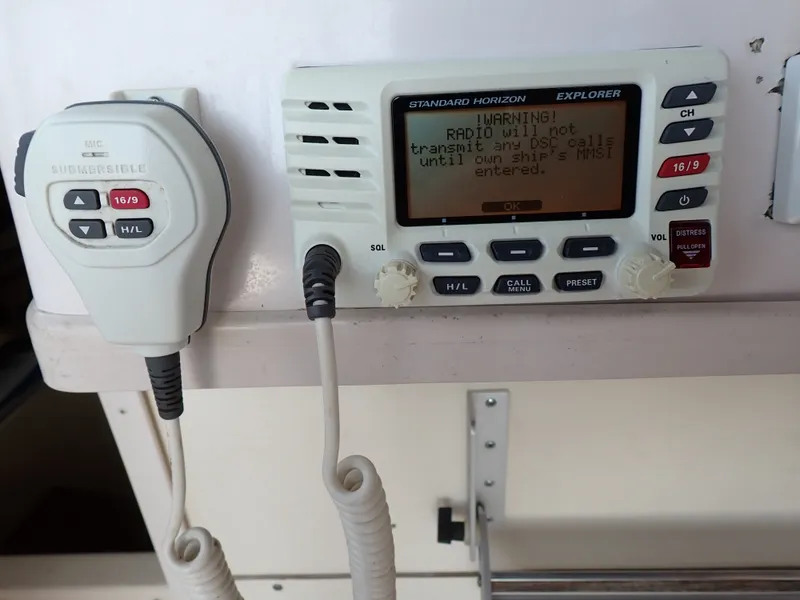 Slide: The Image of Radio with microphone and warning message on a boat. - 19