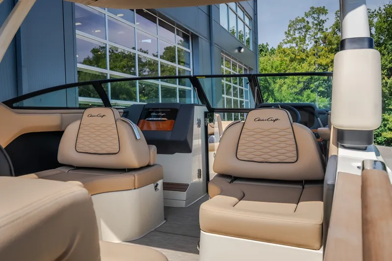 Slide: The Image of 2026 Chris-Craft Sportster 28 interior with luxurious tan seating and modern design. - 17