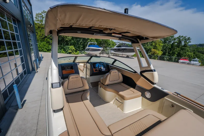 Slide: The Image of 2026 Chris-Craft Sportster 28 boat interior with luxurious seating and canopy. - 24