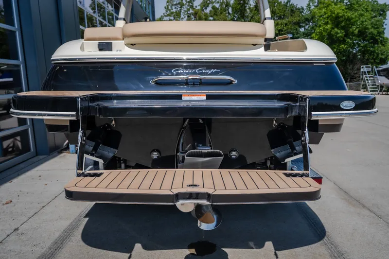 Slide: The Image of 2026 Chris-Craft Sportster 28 rear view, showcasing swim platform and sleek design. - 9