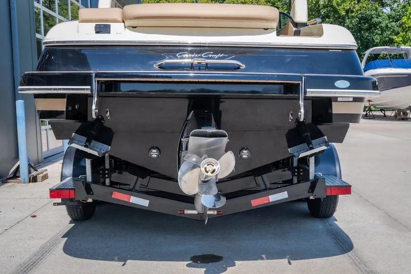 Slide: The Image of Rear view of 2026 Chris-Craft Sportster 28 boat on trailer, showcasing propeller and hull design. - 7