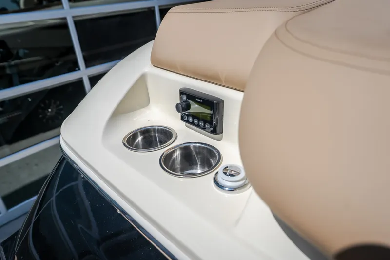 Slide: The Image of 2026 Chris-Craft Sportster 28 boat console with cup holders and control panel. - 16