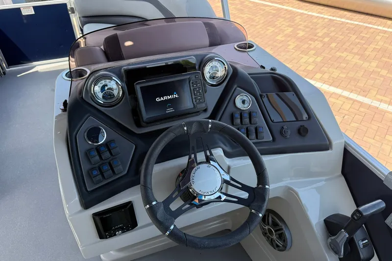 Slide: The Image of 2022 Sylvan L3 DLZ boat dashboard with Garmin navigation system and steering wheel. - 15