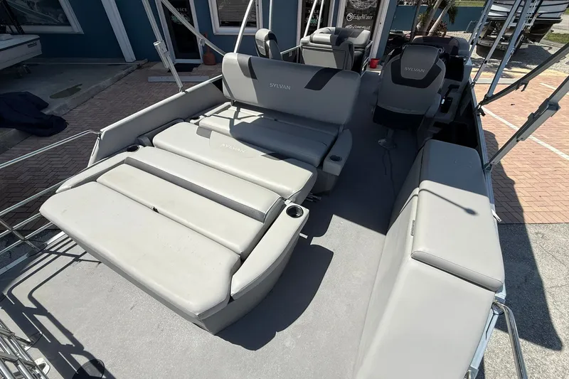 Slide: The Image of 2022 Sylvan L3 DLZ boat interior with gray seating and cup holders. - 8