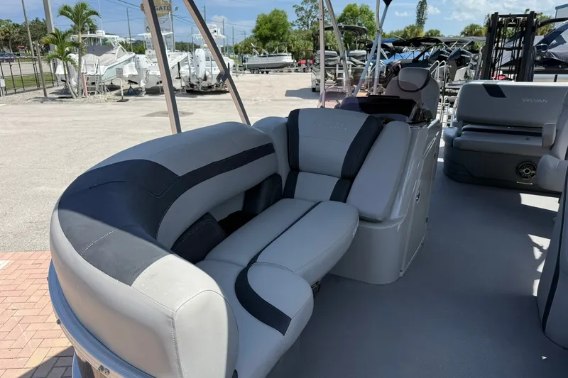 Slide: The Image of 2022 Sylvan L3 DLZ pontoon boat interior with plush seating and modern design. - 23