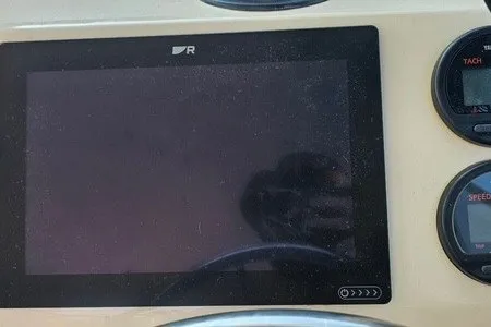 Slide: The Image of Dashboard of a 2004 Parker 2520 Modified Vee Sport Cabin boat with gauges and display. - 4