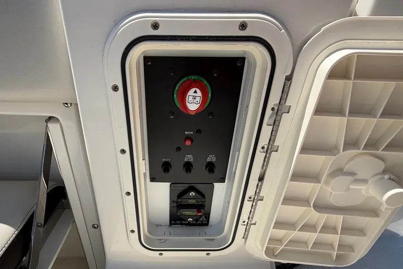 Slide: The Image of Control panel of 2022 Sailfish 245 DC boat with open access hatch. - 23