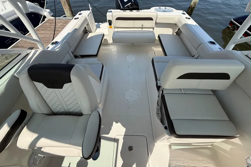 Slide: The Image of 2022 Sailfish 245 DC boat interior with luxurious seating and modern design. - 9