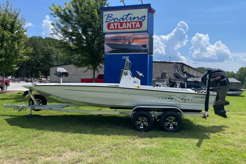 The Image of 2027 Xpress H22 Bay boat on trailer at Boating Atlanta dealership. - 0