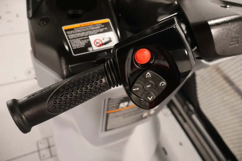 Slide: The Image of Close-up of 2026 Sea-Doo Switch Compact handlebar controls with buttons and grip. - 14