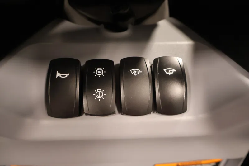 Slide: The Image of Control panel of 2026 Sea-Doo Switch Compact with various function buttons. - 16
