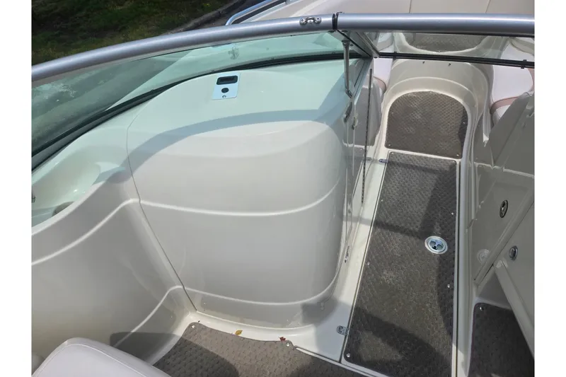 Slide: The Image of Interior view of a 2007 Azure AZ228 boat, featuring sleek design and carpeted flooring. - 15