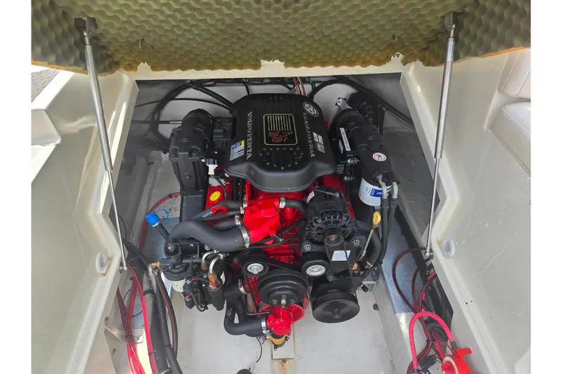 Slide: The Image of Engine compartment of a 2007 Azure AZ228 boat, featuring a Volvo Penta engine. - 24