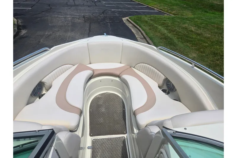 Slide: The Image of Front seating area of a 2007 Azure AZ228 boat with beige and white upholstery. - 18